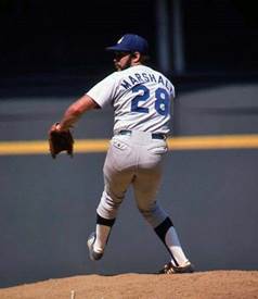 A baseball player throwing a ball

Description automatically generated with medium confidence